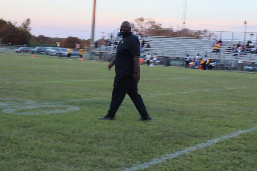 coach haynes walking and smiling