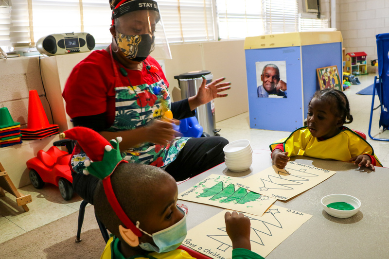 Ms. Gill engaging students in painting activity